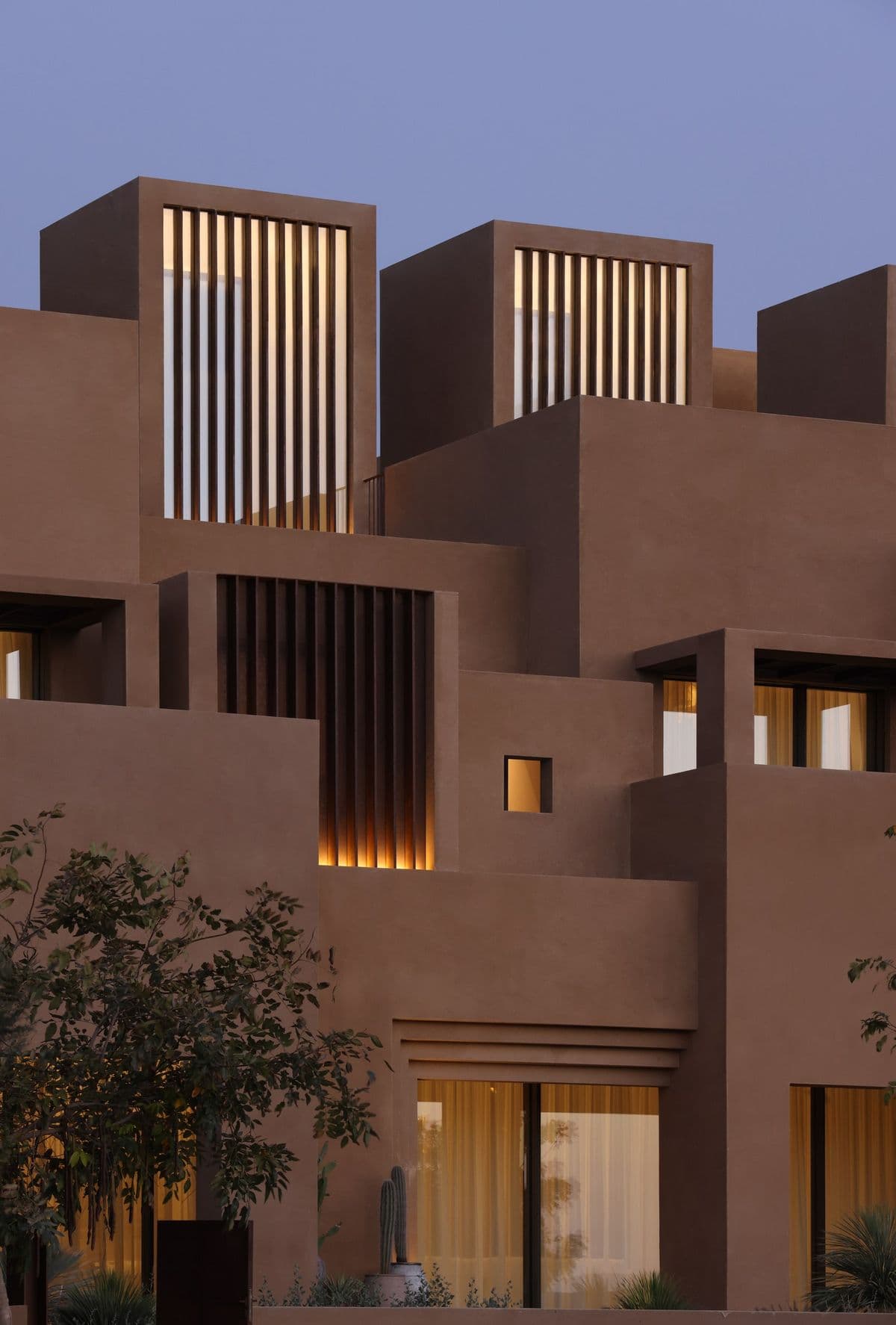 Contemporary Riyadh homes lit at dusk