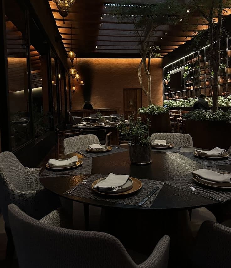 A set table in a warmly lit Riyadh restaurant